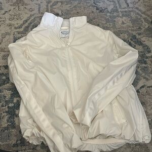 White athleta windbreaker with side zipper and waist elastic